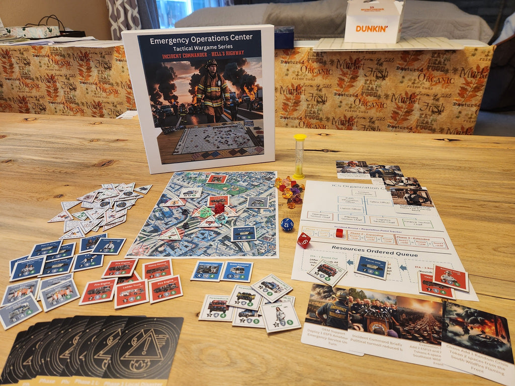 Game setup showing the Incident Commander Hell's Highway board, cards, tokens, sand timer, and scenario sheets on a wooden table.